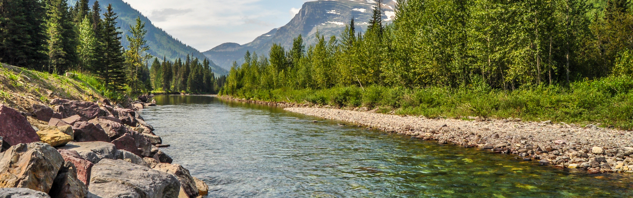 A river running through a valley in Glacier National Park of Montana.