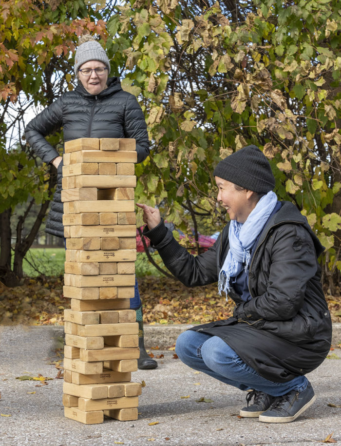 staff playing jenga