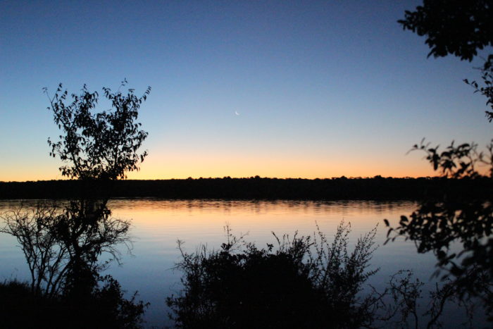 The sun sets on the Rio Negro, soon the fish crew will depart to set nets to better understand the nocturnal fish community in the project area.